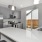 Modern home kitchen with sliding glass doors leading to a private yard at Chapel Creek Cottages