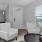 Furnished living room next to the kitchen inside a home at Chapel Creek Cottages