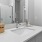 Gray vanity with a white countertop in a modern bathroom inside a home at Chapel Creek Cottages