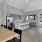 Chapel Creek Cottages resident kitchen with modern gray cabinets and a white island and seating