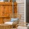 Small seating area with two chairs on the patio outside a unit at Chapel Creek Cottages