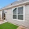 Fenced-in private backyard with a small patio at Chapel Creek Cottages